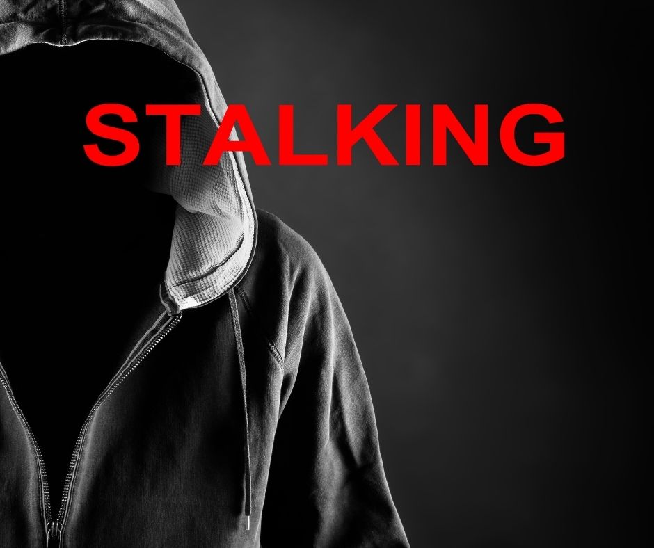 Stalking Nightmare, hooded man, black background